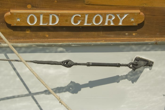 boat named Old Glory in wood
