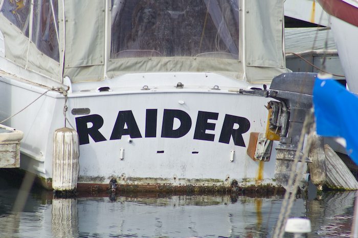 boat named Raider in a thick black font